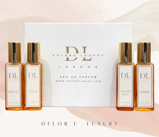 Delor'e Luxury London Eau de Parfum set with four amber glass bottles and gold caps on white background