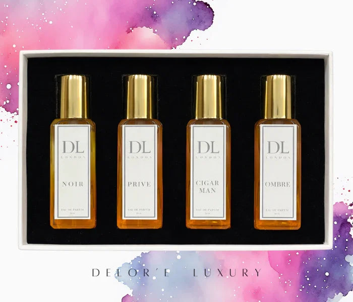 Set of four DL London eau de parfum bottles with gold caps in a black and white gift box